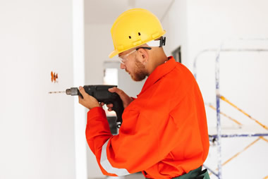 Before and after images of a building renovated by Efudo General Construction Company